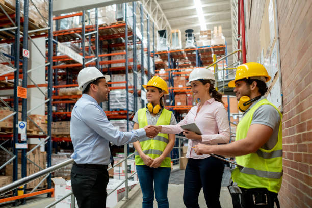 istock Business people closing a deal while working at a warehouse 1191045862
