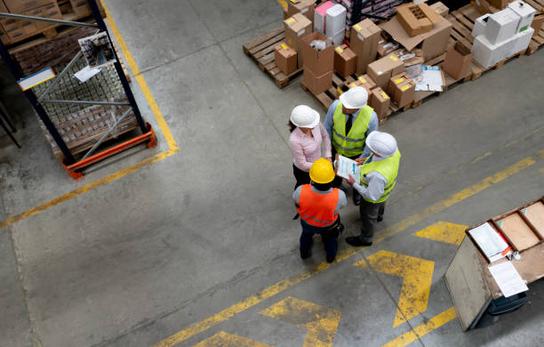 istock Business team in a meeting at a distribution warehouse 1191049679