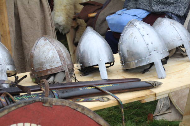 Saxon Helmets Selection of replica helmets of the type that were worn at the time of the Battle of Hastings. anglo saxon photos stock pictures, royalty-free photos & images