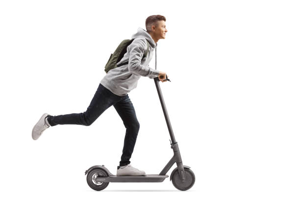 istock Male student with a backpack riding an electric scooter 1191063631
