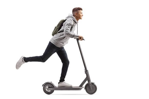 utilgivelig forbruge enkelt gang Male Student With A Backpack Riding An Electric Scooter Stock Photo -  Download Image Now - iStock