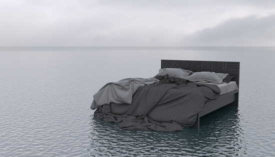 The bed floats on the surface of a calm sea or ocean in cloudy weather. Outdoor bedroom in the open air. Conceptual creative illustration with copy space. Imagination in a dream. 3D rendering
