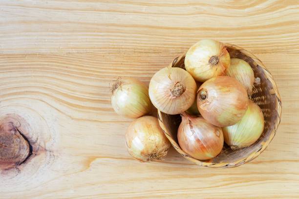 istock Organic onions in a  basket 1191067031