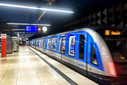Munich, Germany - Aug 2, 2019: Inside the metro station in Munich. Train movies in modern subway. Panoramic view of platform of urban underground. Concept of city transport in Europe.