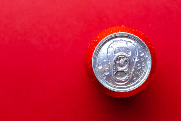 istock Beverages soda can with condensation drops over red background with place for text 1191068702