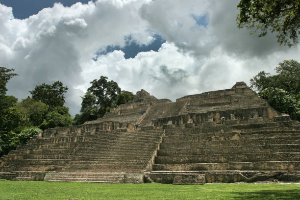 istock Storm clouds build over visitors on Maya Caracol Caana Temple pyramid Belize 1191068784