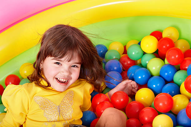 istock Happy child in group colourful ball. 119107294