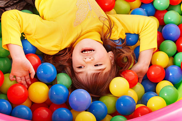 istock Happy child in group colourful ball. 119107296