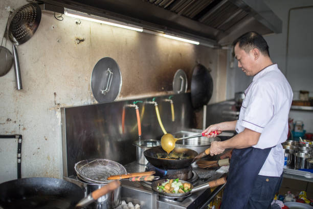 istock An Asian Chinese chief is cooking in the kitchen 1191073996