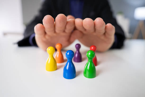 istock Protecting Colorful Pawns 1191080357