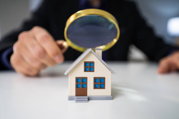 istock Magnifying Glass And Small House 1191080360