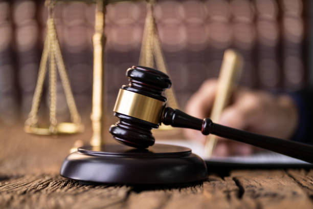 istock Judge Writing On Legal Documents 1191080382