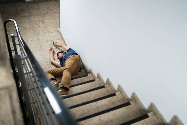 istock Unconscious Man Lying On Staircase 1191080409