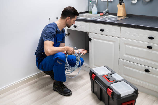 istock Plumber Cleaning Clogged Sink Pipe 1191080427