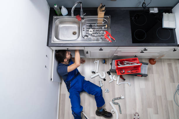 istock Male Plumber In Overall Fixing Sink Pipe 1191080432