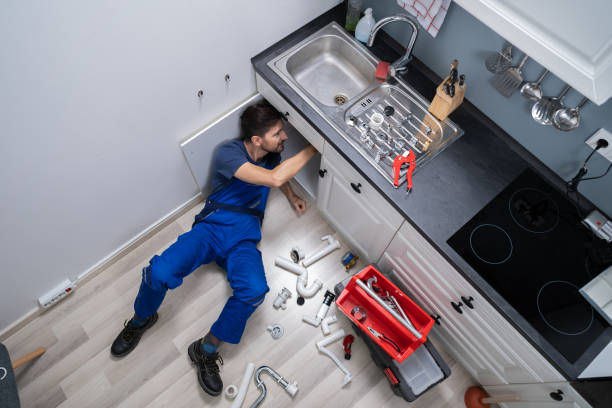 istock Male Plumber In Overall Fixing Sink Pipe 1191080444