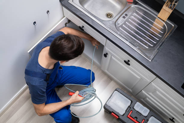 istock Plumber Cleaning Clogged Sink Pipe 1191080446