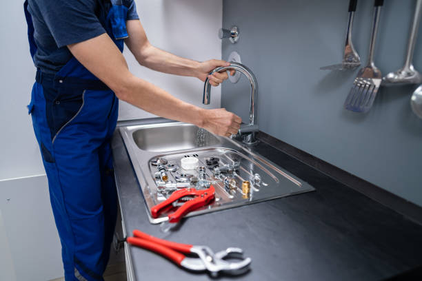 istock Plumber Fixing Faucet In Kitchen 1191080451