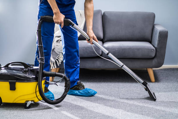 istock Person Cleaning Carpet With Vacuum Cleaner 1191080461