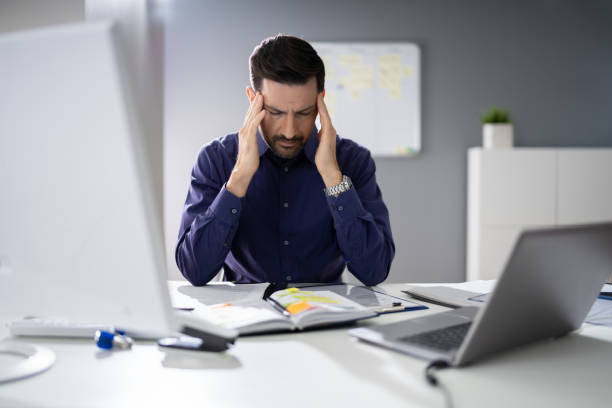 istock Businessman Suffering From Headache 1191080751
