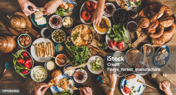 Traditional Turkish Breakfast And People Taking Various Food Wide Composition Stock Photo - Download Image Now