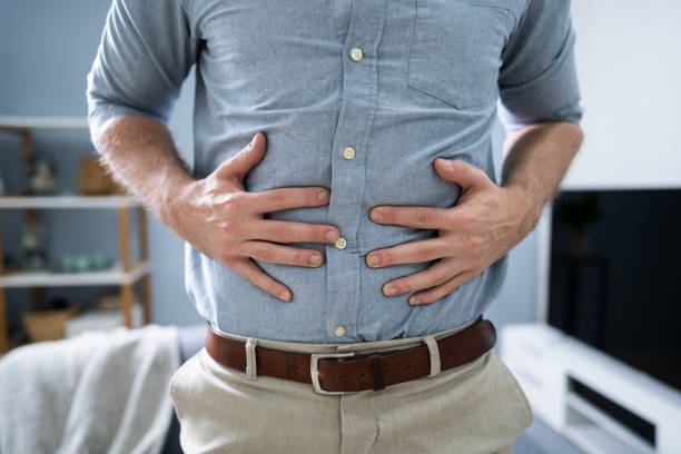 Man In Pain Holding His Stomach