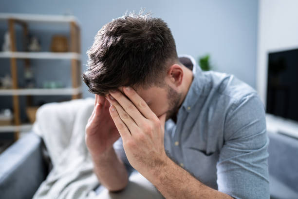 istock Man Suffering From Headache At Home 1191081080