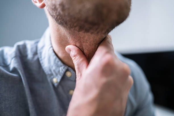 istock Man Suffering From Sore Throat 1191081088