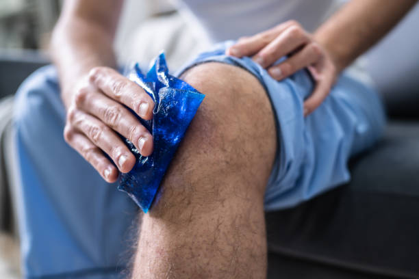 istock Man Applying Ice Gel Pack On His Knee 1191081095
