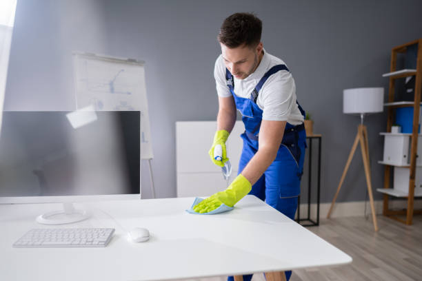 istock Man Cleaning The Glass Office Desk With Rag 1191081835