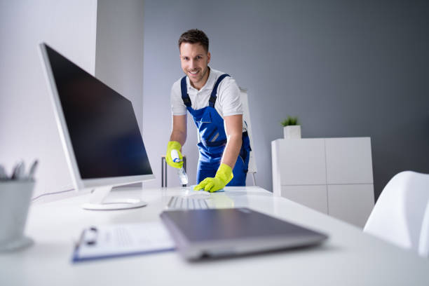 istock Man Cleaning The Glass Office Desk With Rag 1191081841