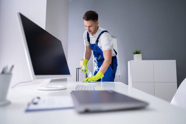 istock Man Cleaning The Glass Office Desk With Rag 1191081853