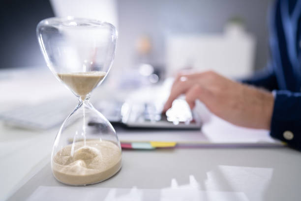 istock Businessperson's Hand Calculating Invoice In Office 1191082006