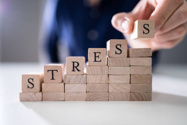 istock Person's Hand Placing Last Alphabet Of Word Stress 1191082102