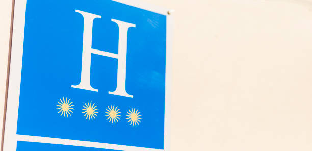 Four star hotel sign on wall