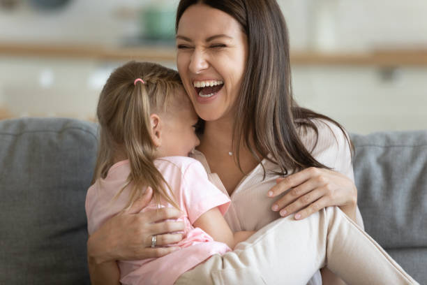 istock Cheerful young mom laughing playing with cute small child daughter 1191083791