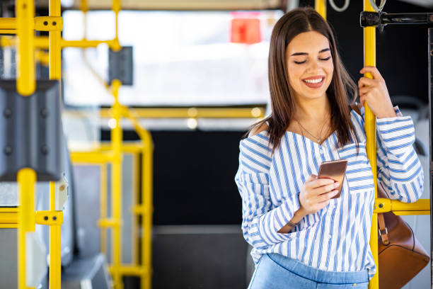 istock A young lady using a smartphone on the bus 1191083910
