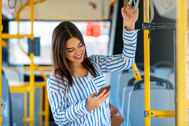 istock Woman Using Smartphone While Riding In Public Transport. 1191083992