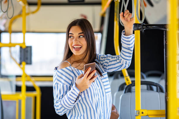 istock Young Woman Texting On Her Smart Phone In Public Transportation 1191084676