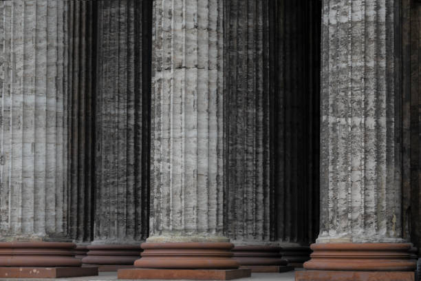 istock A row of gray classic stone columns with a brown base. Distant columns are also visible in the background. Architecture. St. Petersburg. Russia 1191086356