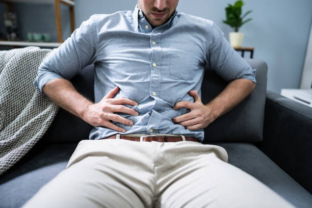 istock Man In Pain Holding His Stomach 1191088512