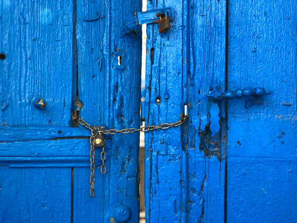 istock Old weathered blue board wooden door 1191091461