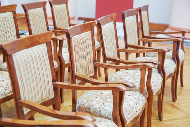 istock Elite seats, comfortable armchairs, Conference room with brown many armchairs . Many empty armchairs. 1191091677