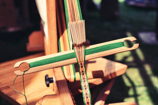 istock Ribbon weaving on a loom, close up 1191092825