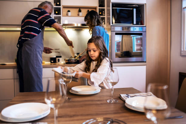 istock Cute Girl Setting The Table 1191095700