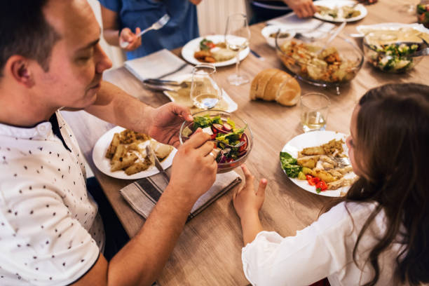 istock Family Having Lunch At Home Together 1191095739