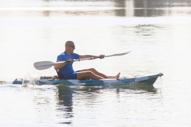 istock Kayaker Man Paddle Kayak. Kayaking, Paddling, Canoeing. 1191096808