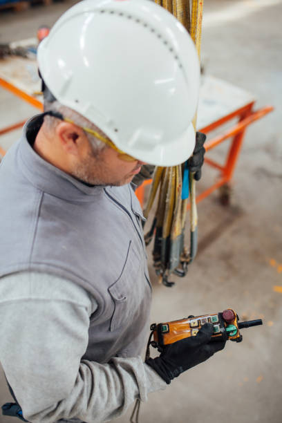 istock Enginee  holding and working with remote control for operating crane stock photo 1191096975