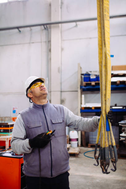 istock Enginee  holding and working with remote control for operating crane stock photo 1191097071