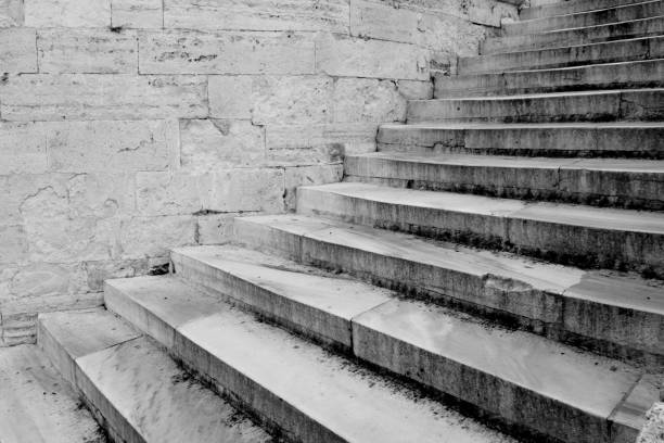 Black and white photo of the stairs of an old building
